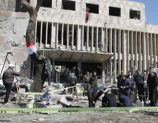 Blasts in Syrian capital kill 27