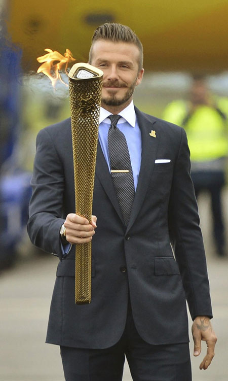 Beckham lights the Olympic torch