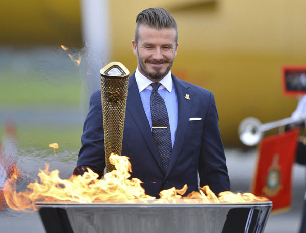 Beckham lights the Olympic torch