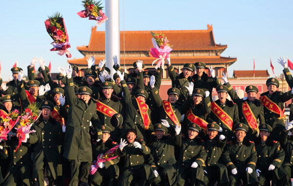 Retiring soldiers pose for a group photo on Tian'anmen Square in Beijing on Nov 23, 2012. Final salute