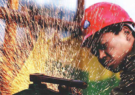 Manufacturing expands in Feb, but at slower pace