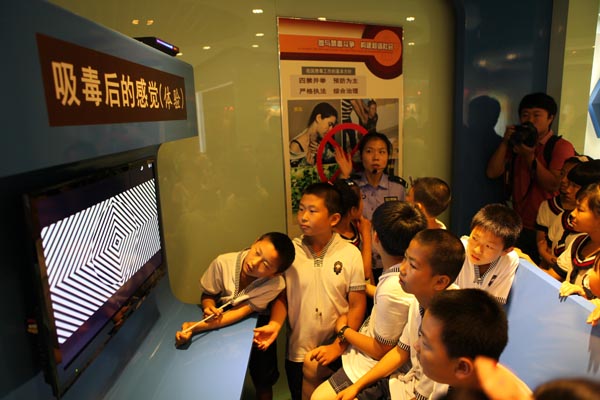 Students learn how it feels after taking drugs with audio and visual effects at the Anti-Drug Education Center in Shenyang, Liaoning province, on June 25, 2013. Anti-drug campaigns around China
