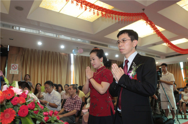 A Buddhism wedding held in Xiamen city, Fujian province on July 6, 2013. Buddhist wedding chimes in E China