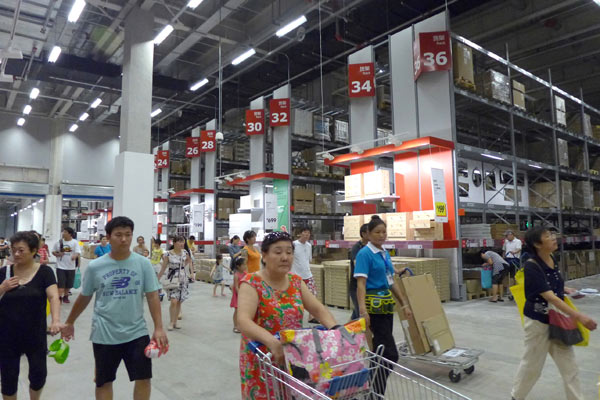 Shoppers browse through an IKEA store in Shanghai. According to experts, consumer spending in the United States has been as much as 70 percent of the economy, compared with 45.9 percent in China in the first three quarters. Provided to China Daily Consumer spending falls short