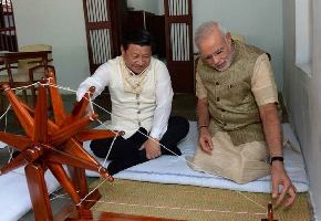 President Xi and wife play swing in Modi's home state