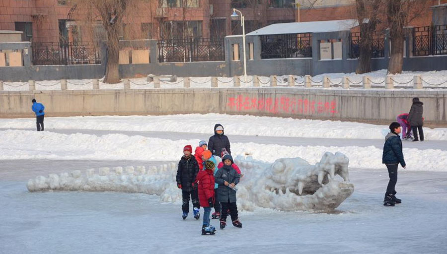 Giant crocodile sculpture made with snow