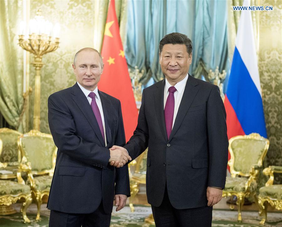 China, Russia pledge to play role of ballast stone for world peace