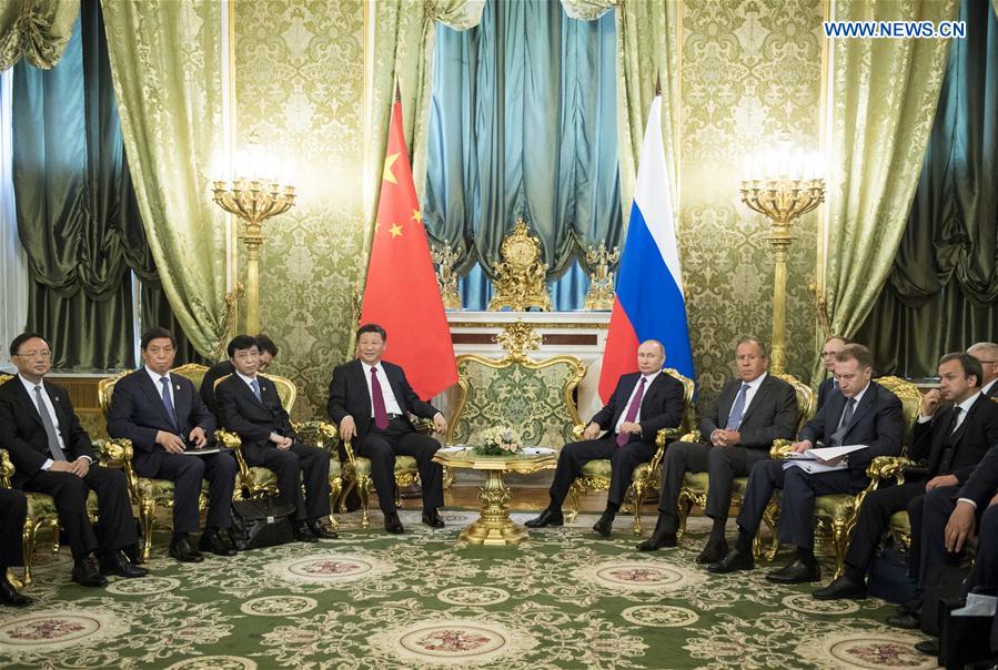 China, Russia pledge to play role of ballast stone for world peace