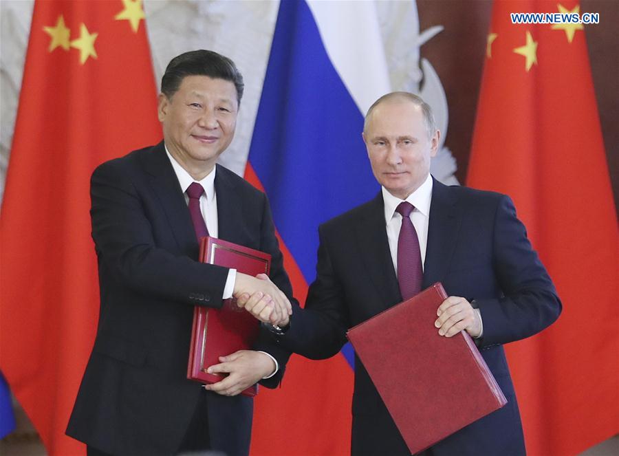 China, Russia pledge to play role of ballast stone for world peace