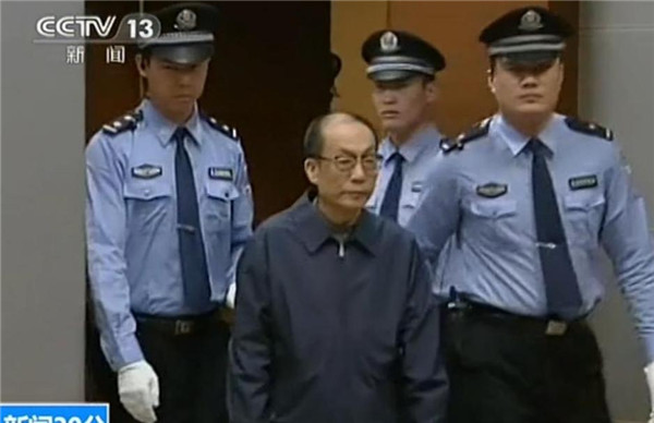 A screenshot from China's Central Television shows former railways minister Liu Zhijun standing trial in a court in Beijing on Sunday. Former railways minister stands trial