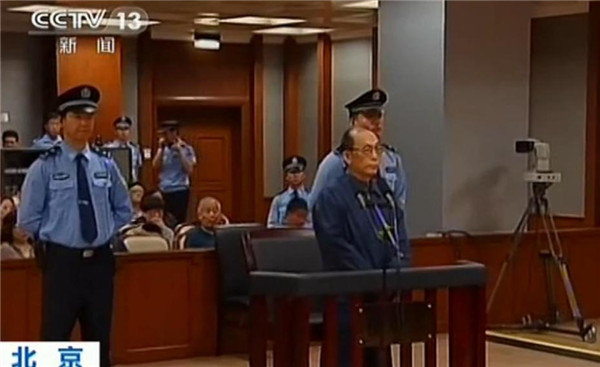 A screenshot from China's Central Television shows former railways minister Liu Zhijun standing trial in a court in Beijing on Sunday. Former railways minister stands trial