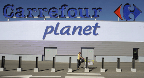 Carrefour reduces dividend, scales down conversions