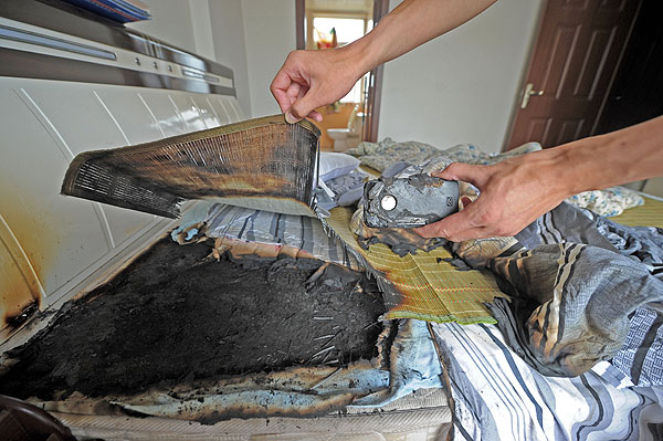 The charred remains after the iPhone 4 exploded in Wang Kai's bedroom in Chongqing, on July 9, 2013. Safety fears after iPhone 4 explodes