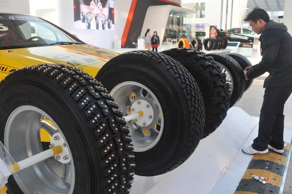 Tire firms urge government to fight US action