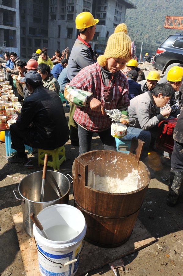 Cooking lunch for Chinese construction workers