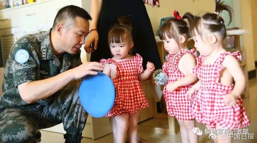 Sad farewell: Daughters say goodbye to peacekeeping soldier