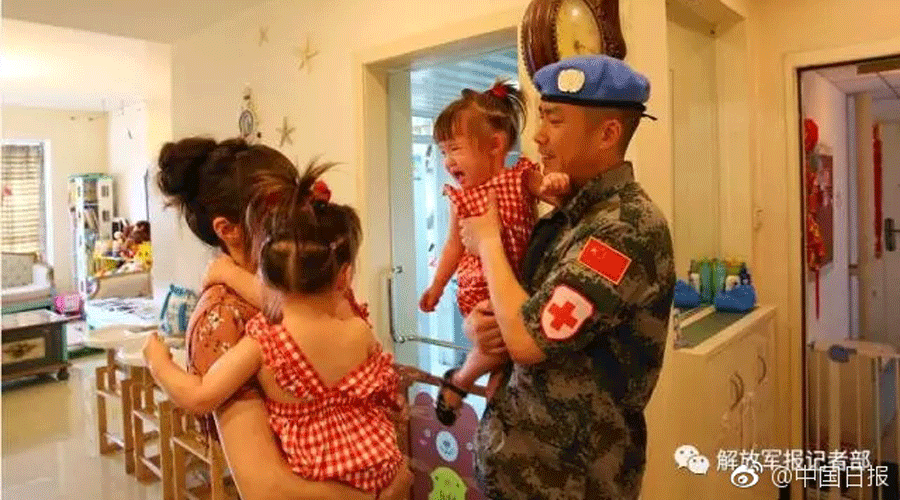 Sad farewell: Daughters say goodbye to peacekeeping soldier