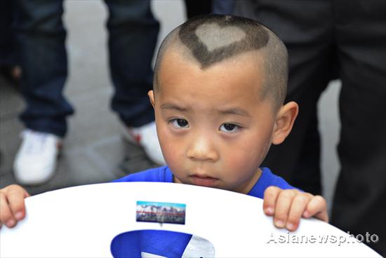 Boy wears Mickey Mouse on his head