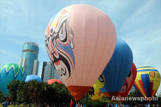 Hot air balloons color S China city sky
