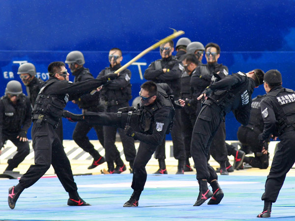 Policemen demonstrate martial arts during the 2011 Jinhua exercise at the Port of Taipei in New Taipei City, northern Taiwan, June 29, 2011. Disaster-response drill in Taiwan