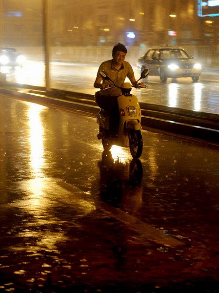 Beijing drenched in downpour