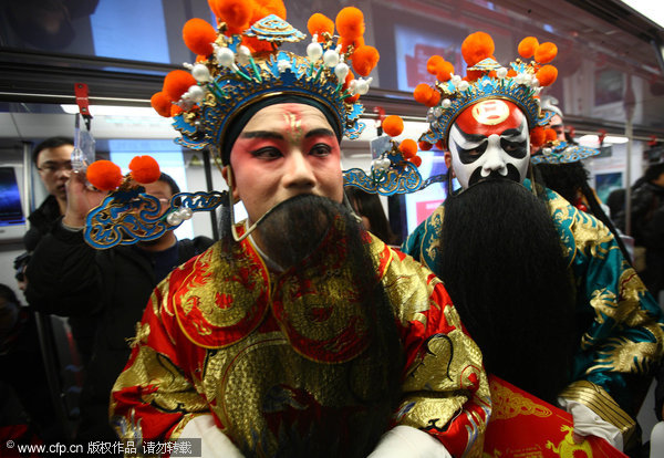 <EM>Kunqu</EM> opera singers share blessings on subway