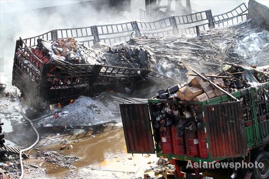 One dead after eight truck blaze