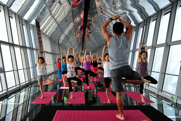 Fans practice yoga at 474m