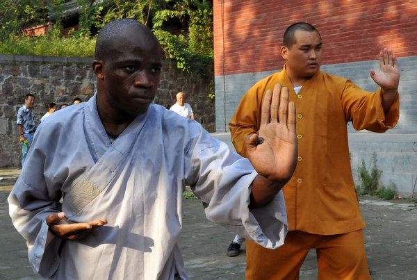 African apprentices practise kung fu at Shaolin Temple