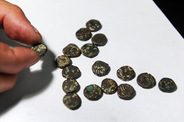 Ancient bronze coins found near old Silk Road