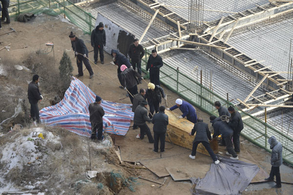 Last tomb standing in construction site relocated