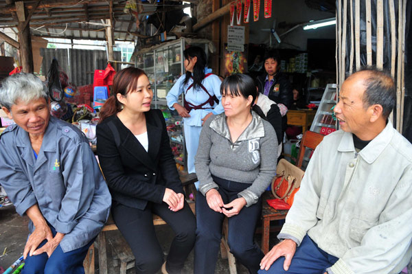 Liang Lina gathers the opinions of villagers before she takes part in the National People Congress in March, Feb 25, 2013. Young deputy has high hopes for village