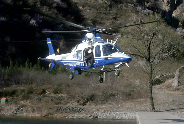 Beijing continues search for missing hiker