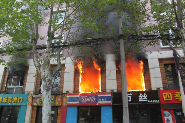 Death toll rises to 13 in central China hotel fire