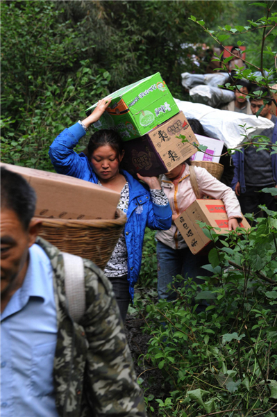 Villagers climb mountains to get relief supplies