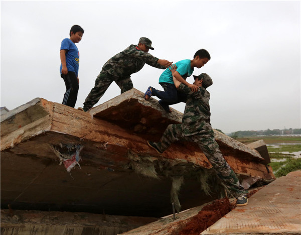 33 dead, 12 missing in S China storms