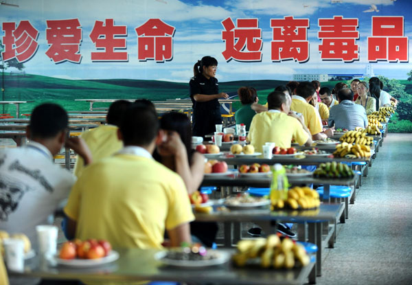 Youngsters recovering from drug addiction meet their relatives at a rehabilitation center in Shanxi, North China’s Shanxi province, June 25, 2013. Battling addiction with compulsory detox