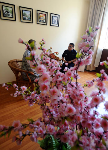 A youngster recovering from drug addiction has psychological counseling at a rehab center in Shanxi, June 13, 2013. Battling addiction with compulsory detox