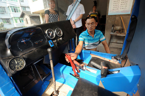 A 54-year-old repairman works to make a rotorcraft to realize his dream, shared by his wife, of flying to the sky, in Southwest China’s Chongqing on July 28, 2013. Repairman has a dream of flying