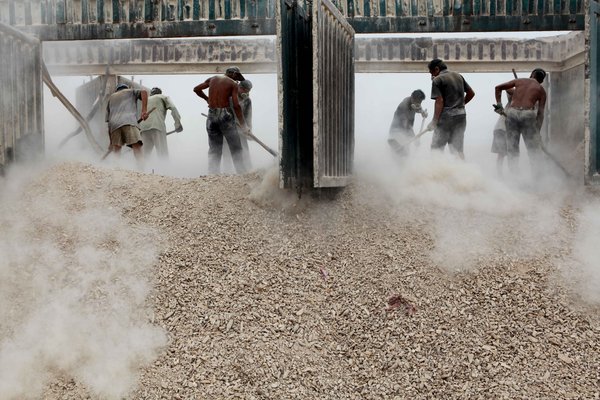 Hard, dusty labor in sweltering times