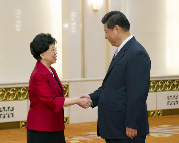 President Xi meets WHO director-general