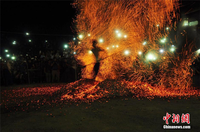 Folk activity 'walking on fire' staged in E China