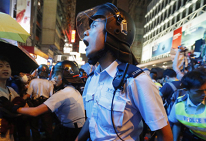 Protesters condemned for charging police cordon in HK
