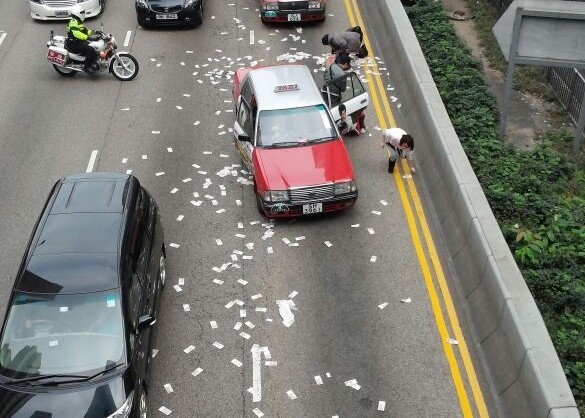 Armor van spills $4m on road in HK