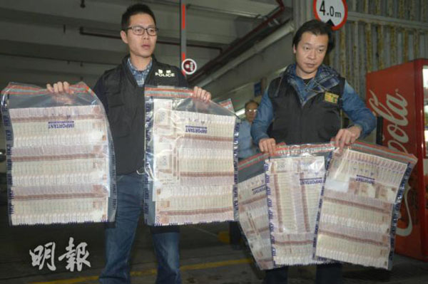 Two arrested in cash spill case in HK