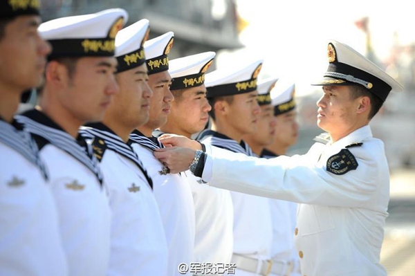 Chinese navy soldiers put on new uniform