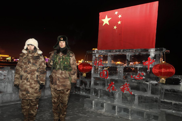 Couple sentries guard China's northern border during traditional holiday