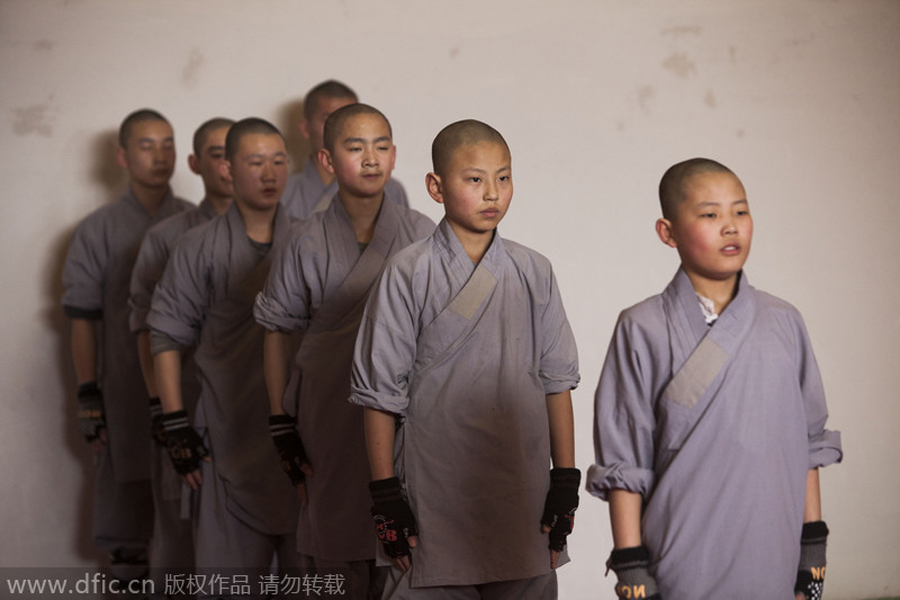 Buddhist monks break bricks in kung fu