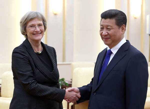 Xi greets president of Harvard