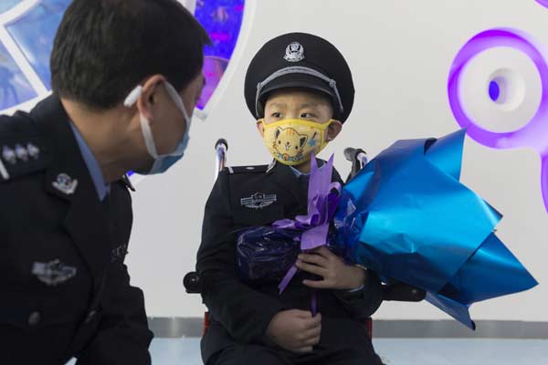 Leukemia boy's policeman dream comes true